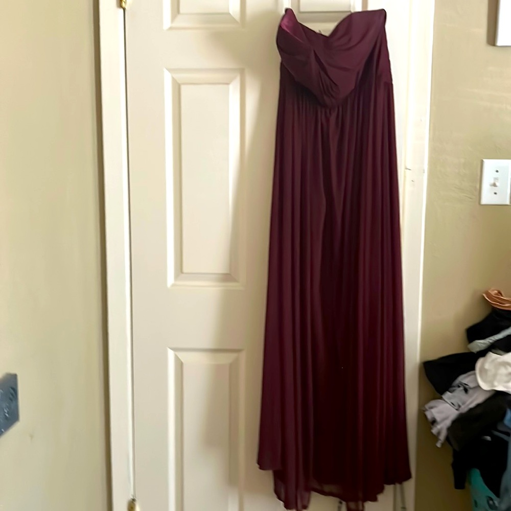 Burgundy color strapless dress. Wore one time for my daughter’s wedding.